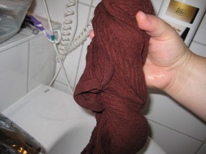 6.  Wring the clothing out over the sink.