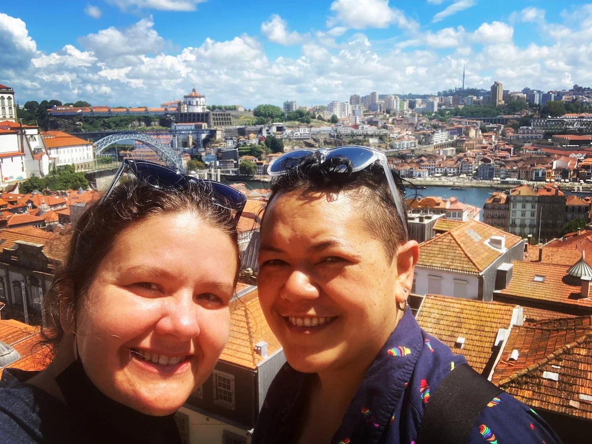 Charity & Maylene at a scenic outlook on the Porto side of the Douro River looking towards Vila Nova da Gaia with the Luis I Bridge in the background