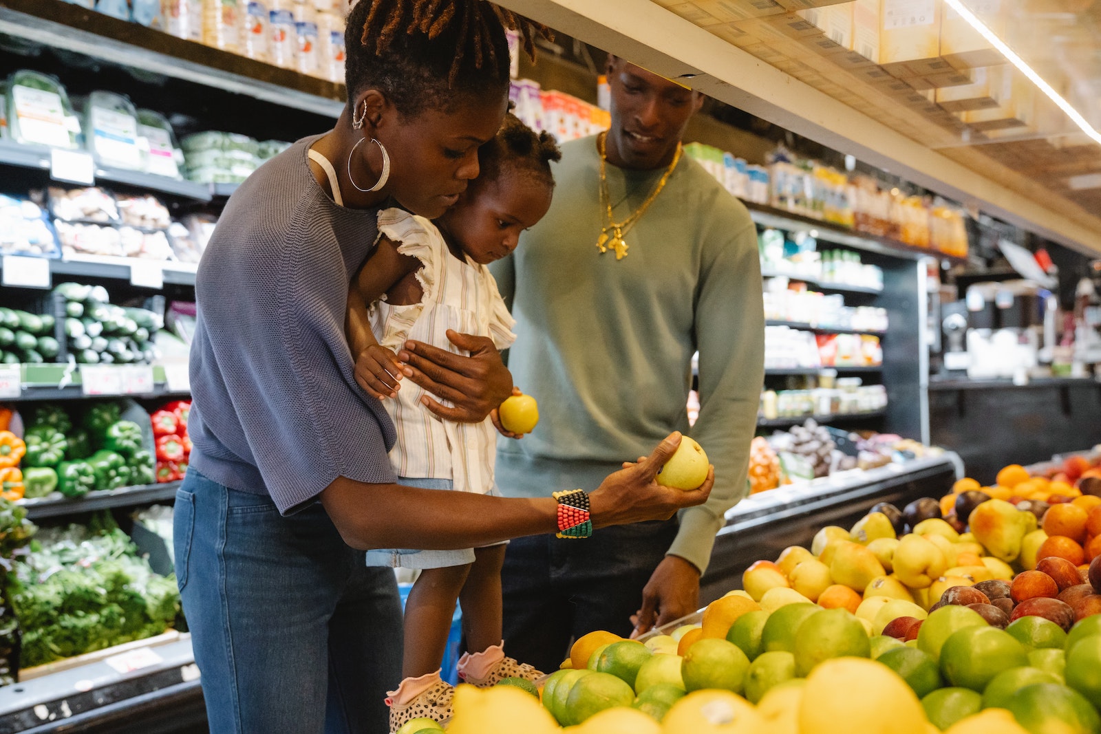 Image of a young family shopping at a grocery store