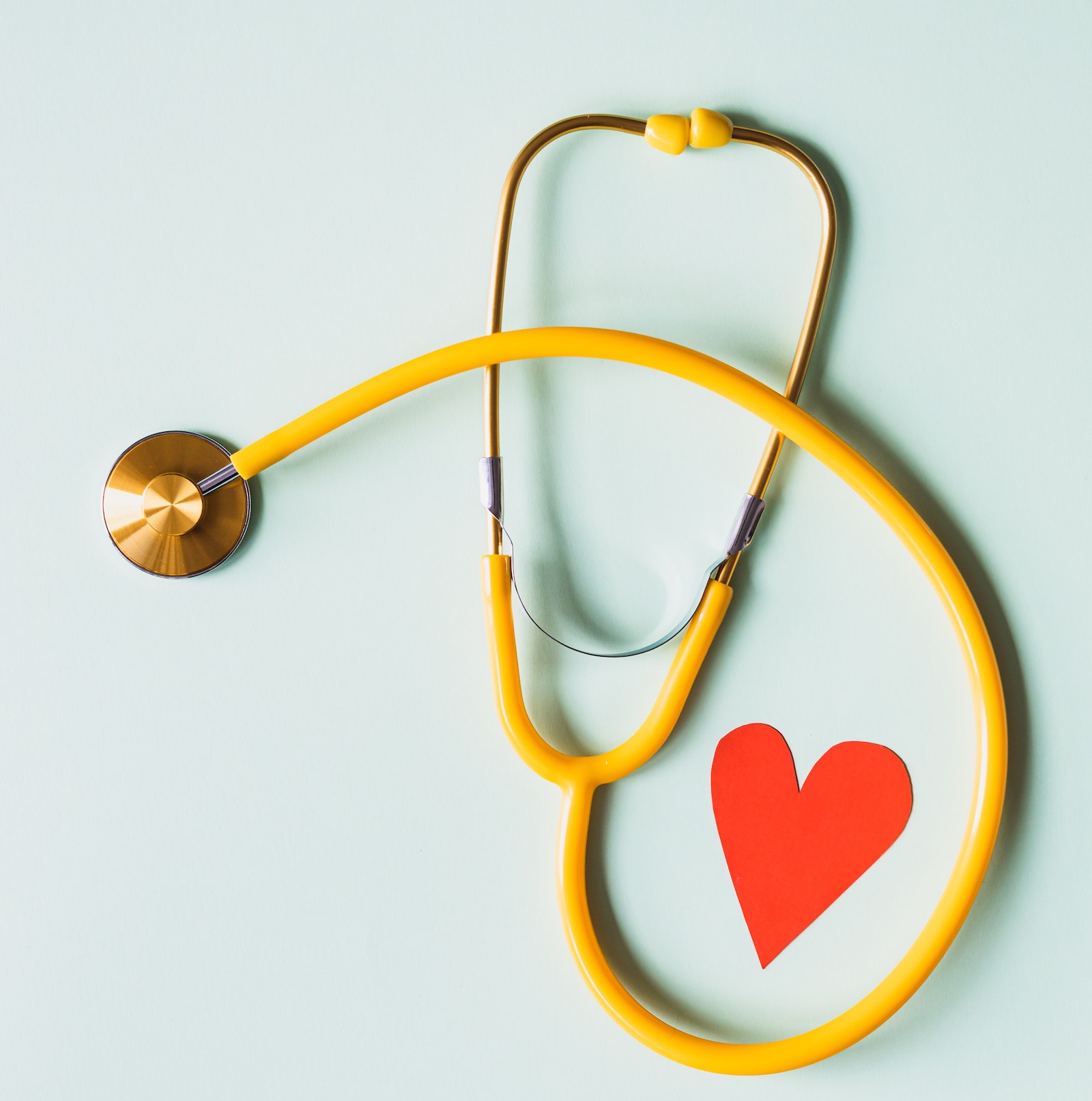 stethoscope with cut-out heart next to it