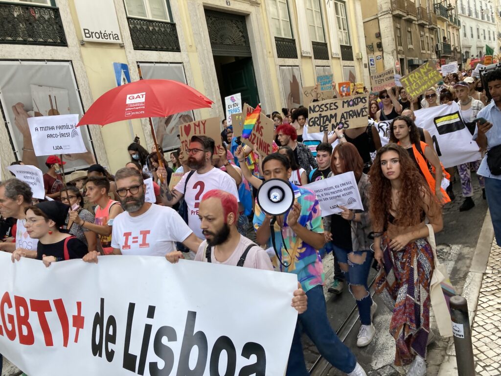 Crowd of people with signs at Pride Parade 2022 in Lisbon