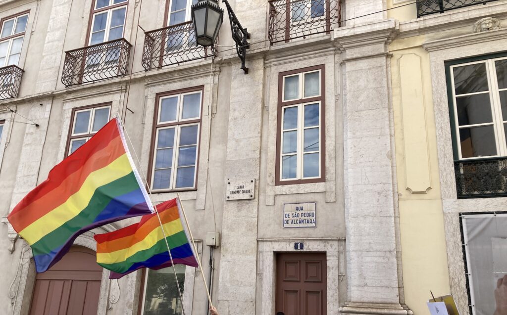 Two rainbow flags on a Lisboa street